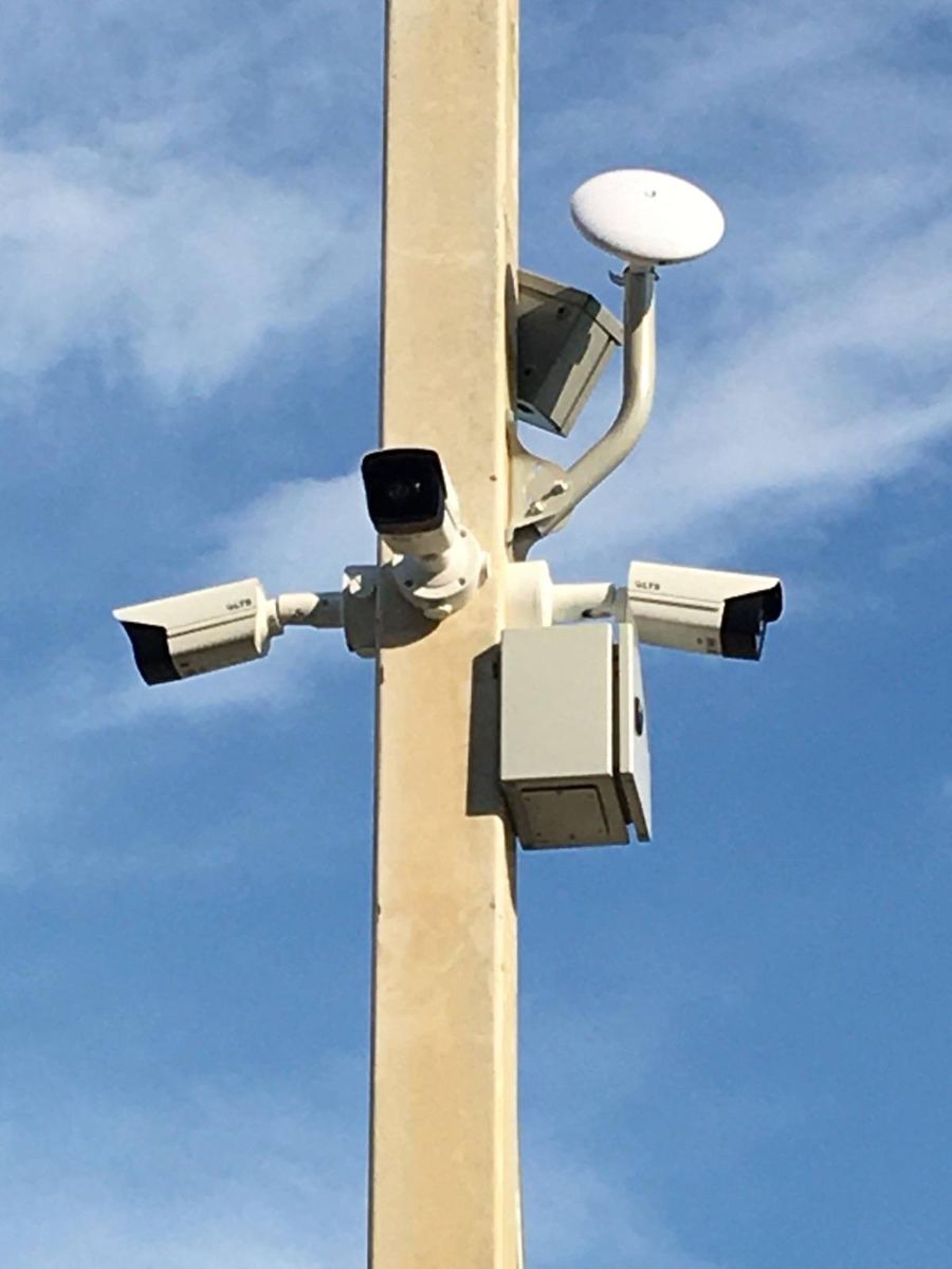 Pole-mounted security cameras installed outdoors